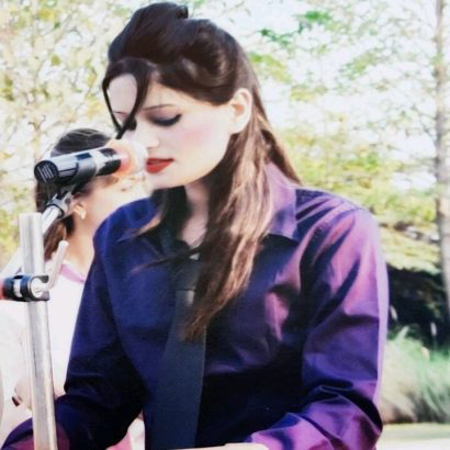 Anushikha Dwivedi mid-address at an outdoor speaking event
